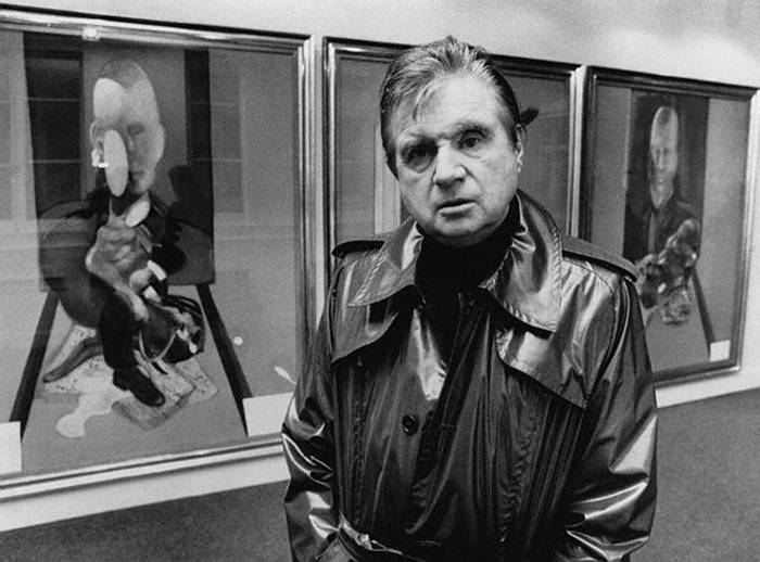 FRANCIS BACON (1909-1992) The artist in front of 'Triptych' 1976, at an exhibition of his work at Claude Bernard Gallery, Paris,1977. 